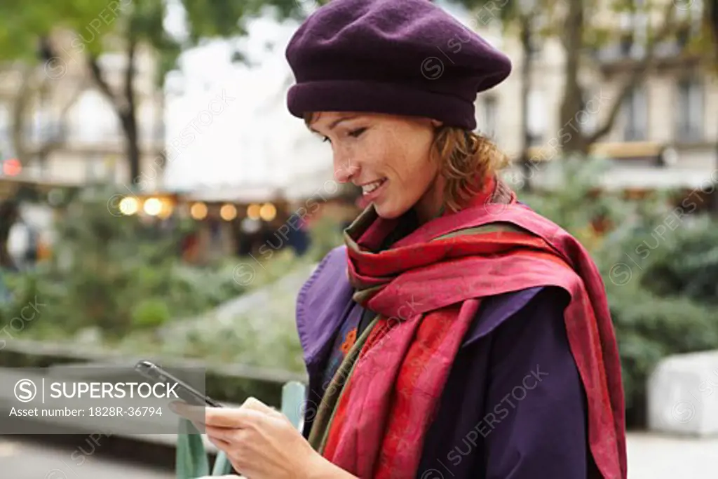 Woman Using Cell Phone Outdoors   