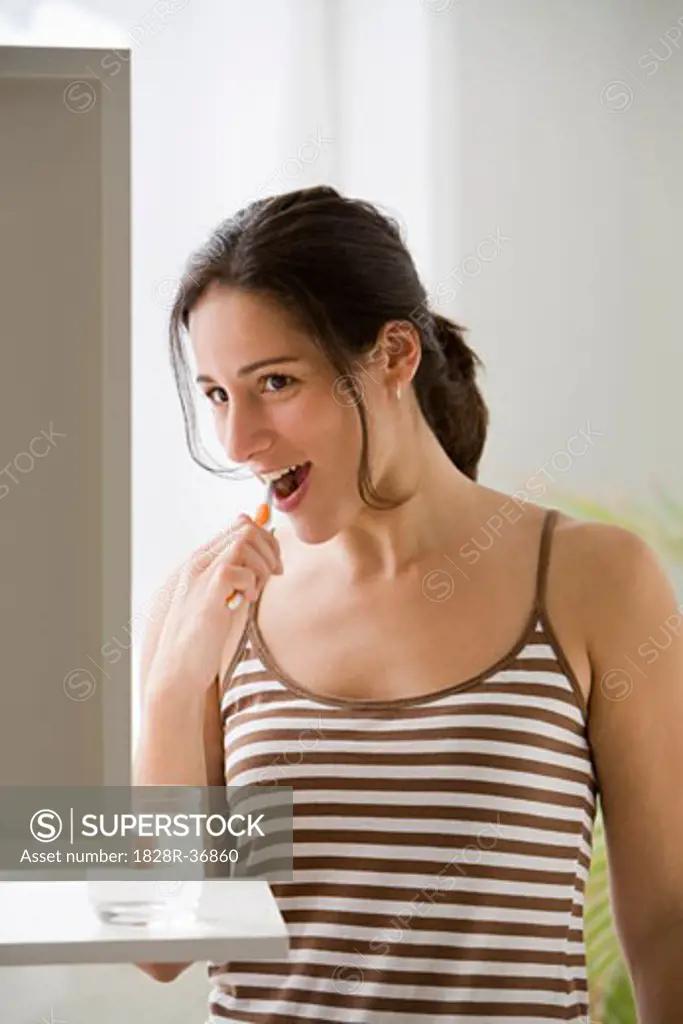 Woman Brushing Teeth   