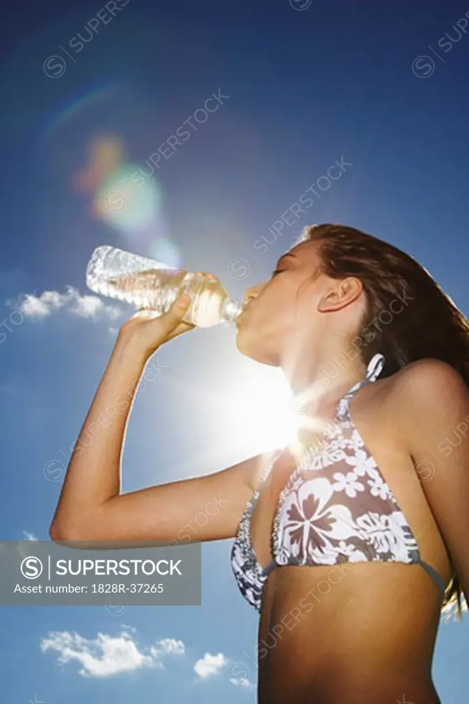 Girl in Bikini Drinking Water   