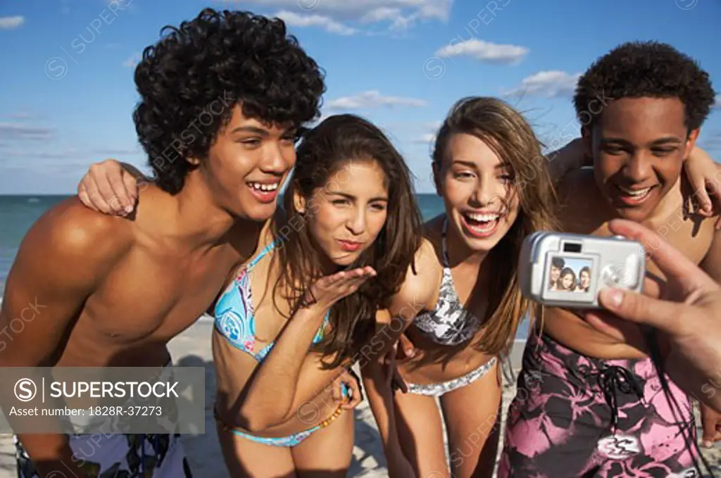 Friends Posing for Picture on Beach   