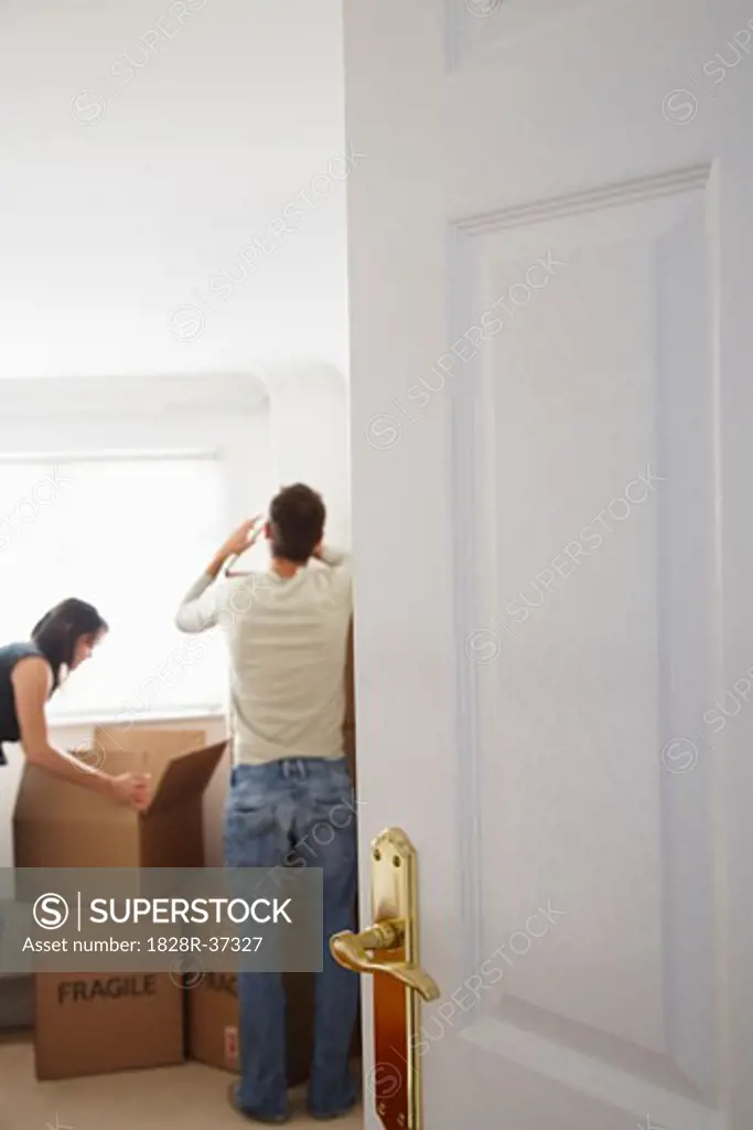 Couple with Boxes in New Home   