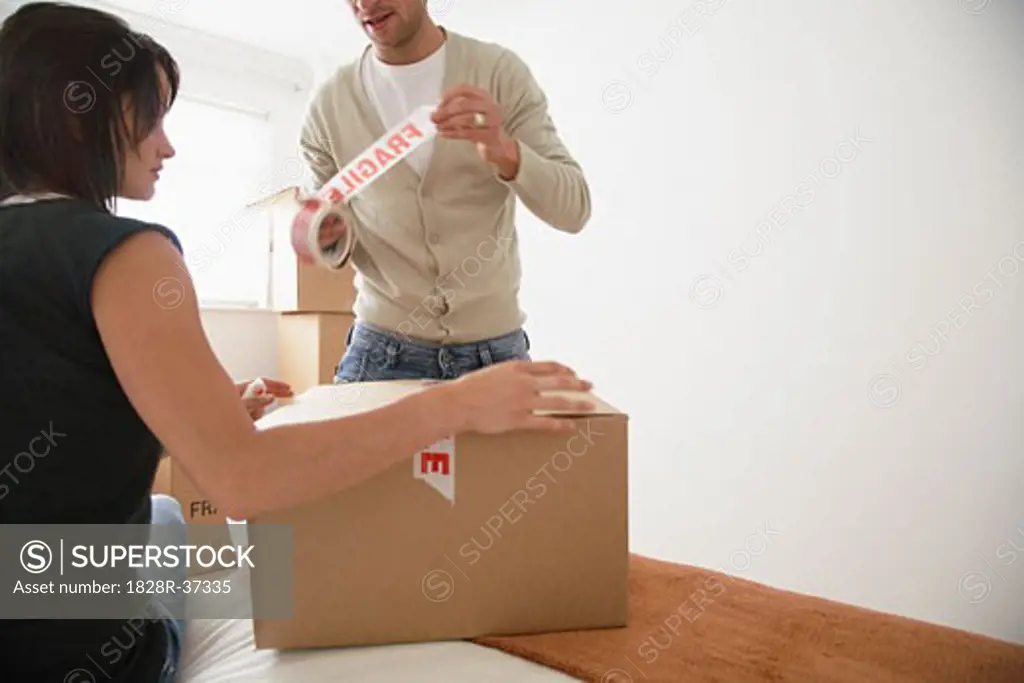 Couple Packing Box in Bedroom   