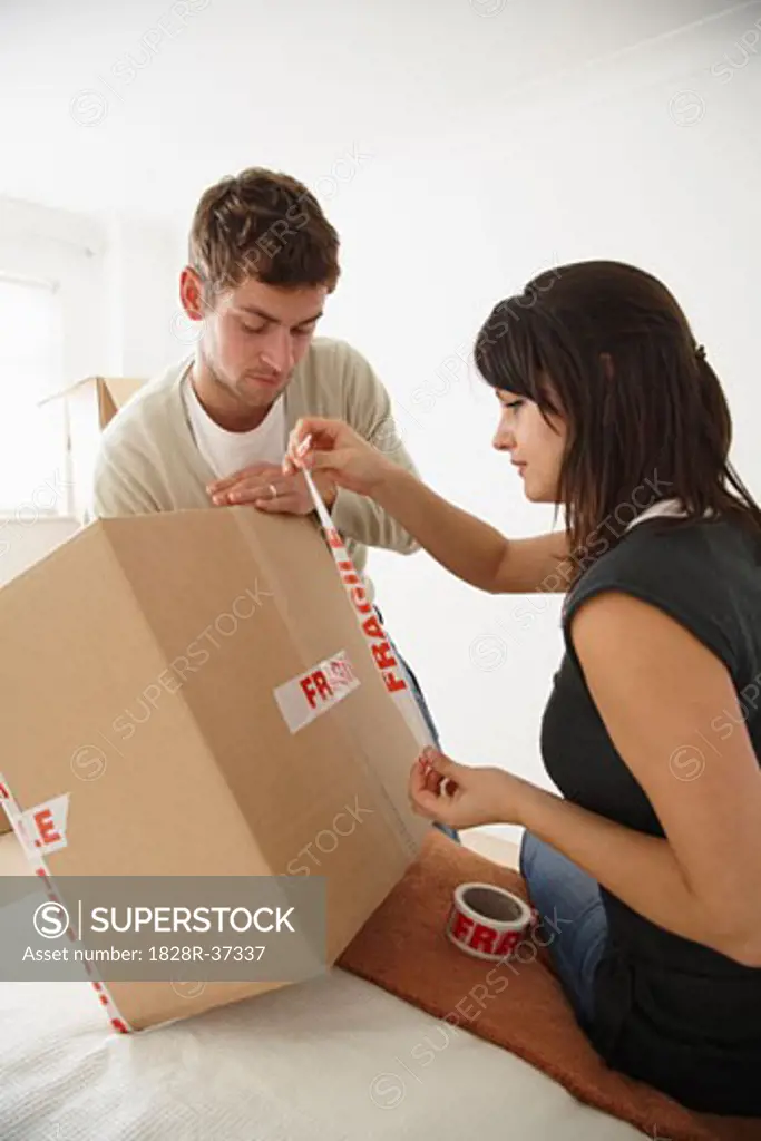 Couple Packing Box in Bedroom   