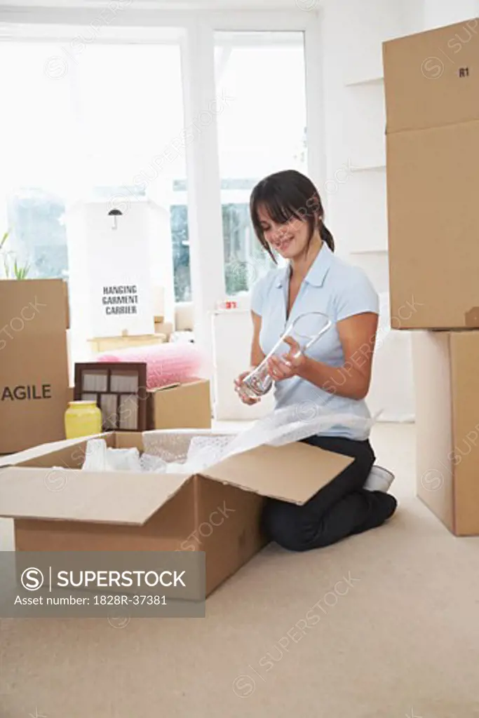 Woman Packing Boxes   