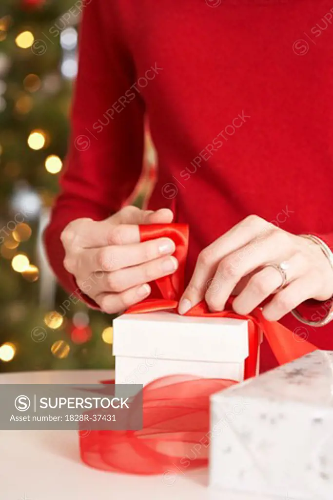 Woman Wrapping Christmas Present   