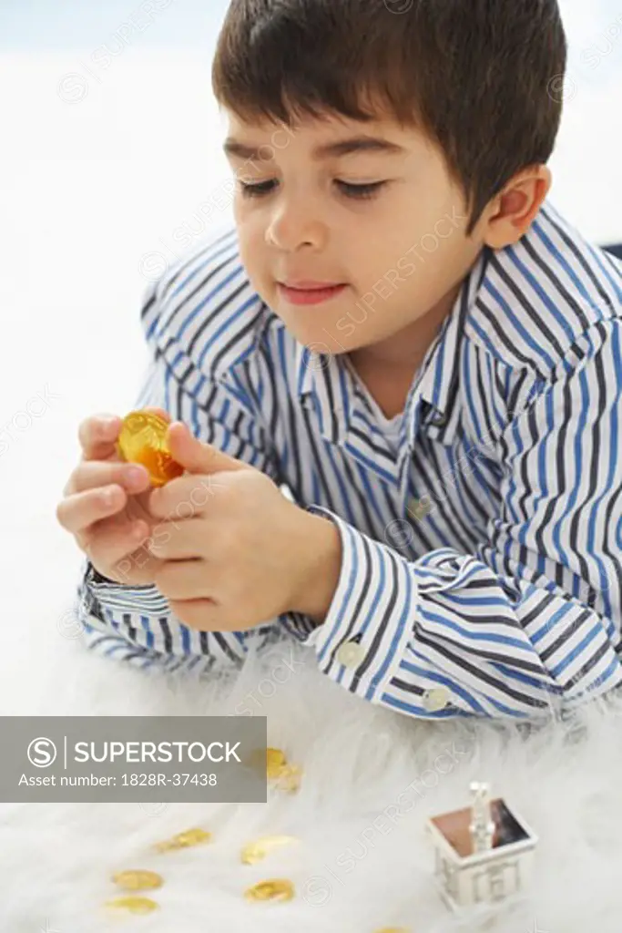 Close-up of Boy Playing with Dreidel   