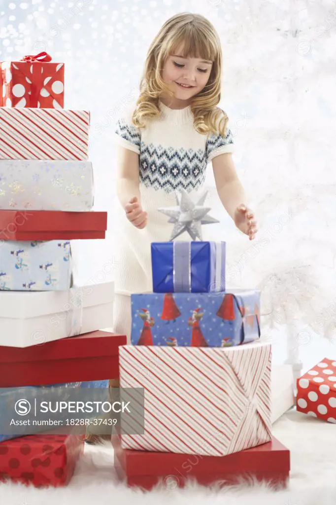 Girl Surrounded by Christmas Presents   