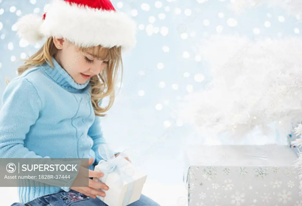 Girl Holding Christmas Present   