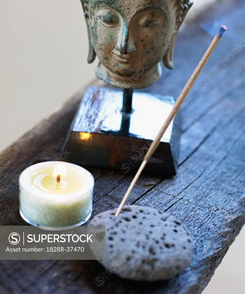 Still Life of Head of Buddha, Candle, and Incense   