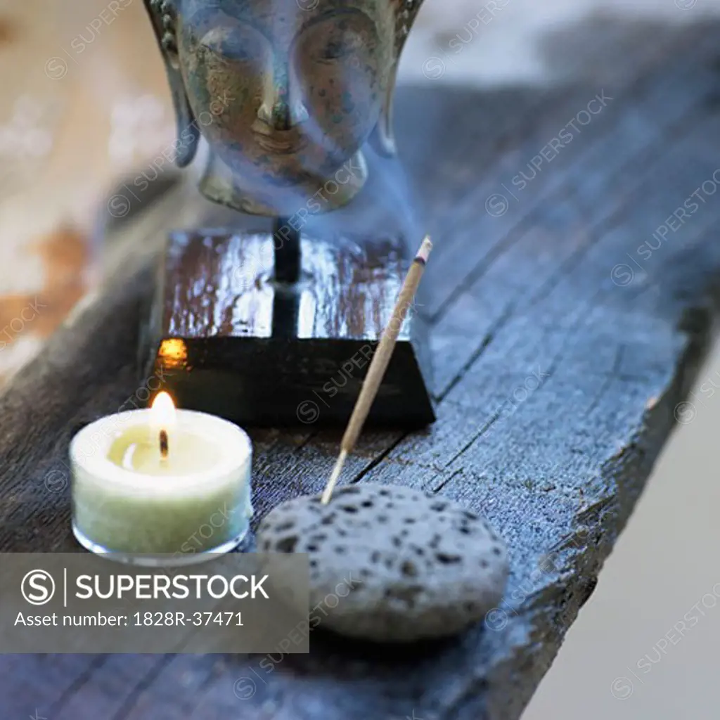 Still Life of Head of Buddha, Candle, and Incense   
