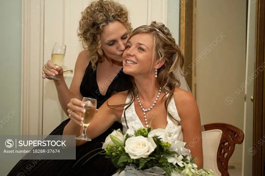Bride and Bridesmaide with Champagne   