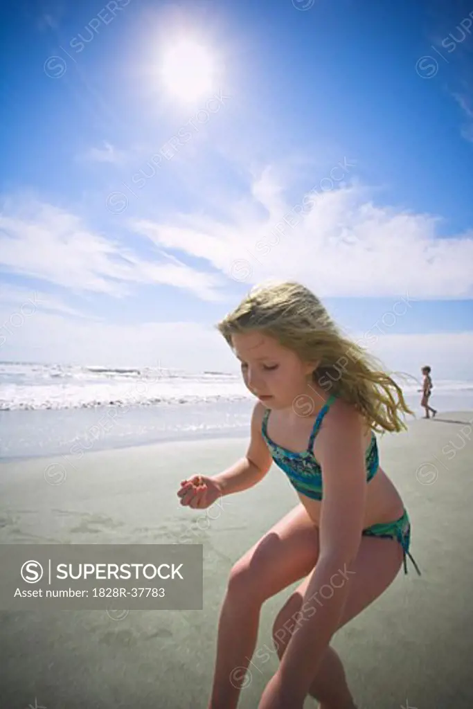 Girl Playing on Beach   