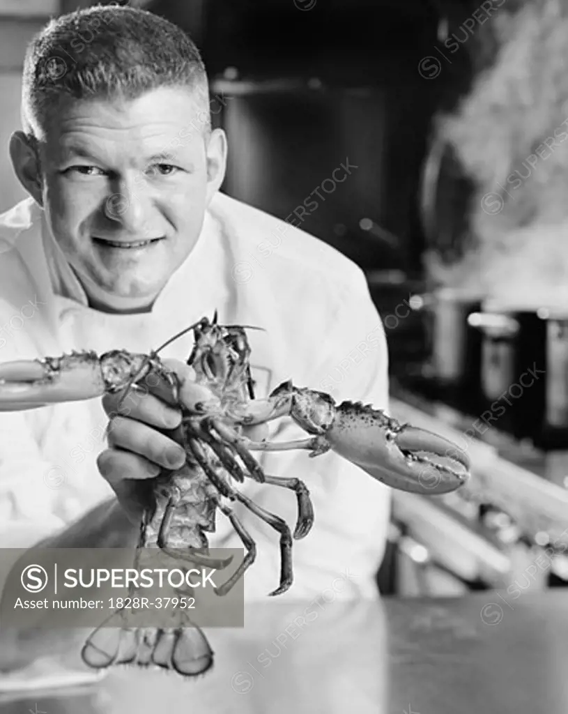 Chef Holding Lobster   