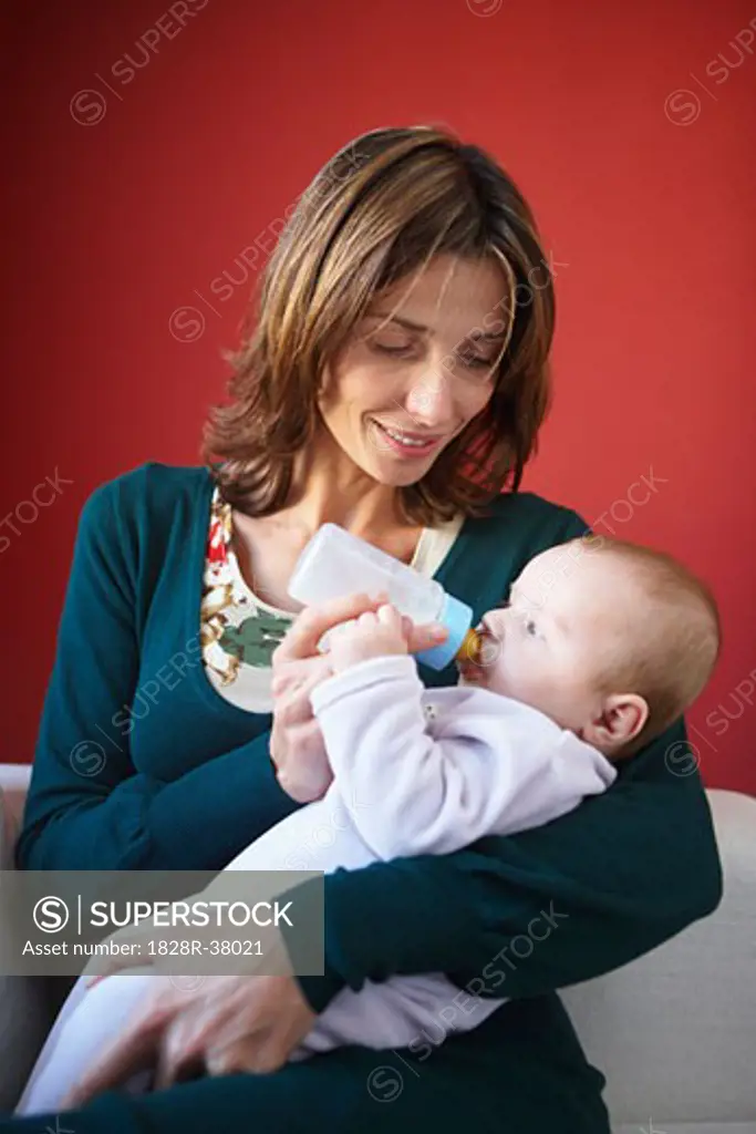 Mother Feeding Baby with Bottle   