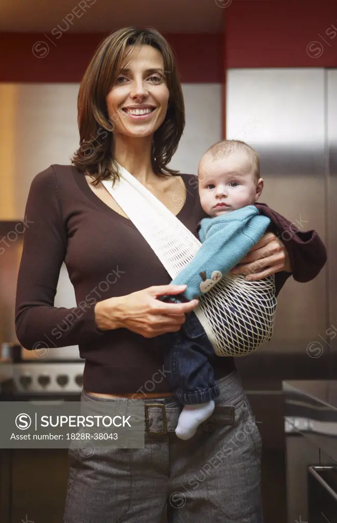 Woman with Baby in Kitchen   