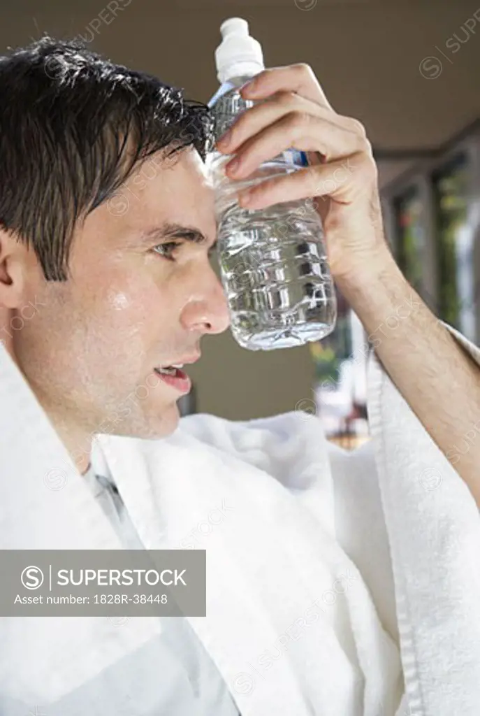 Man with Water Bottle after Exercising   
