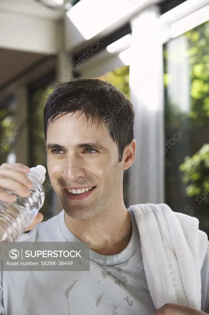 Man Drinking Water after Exercising   