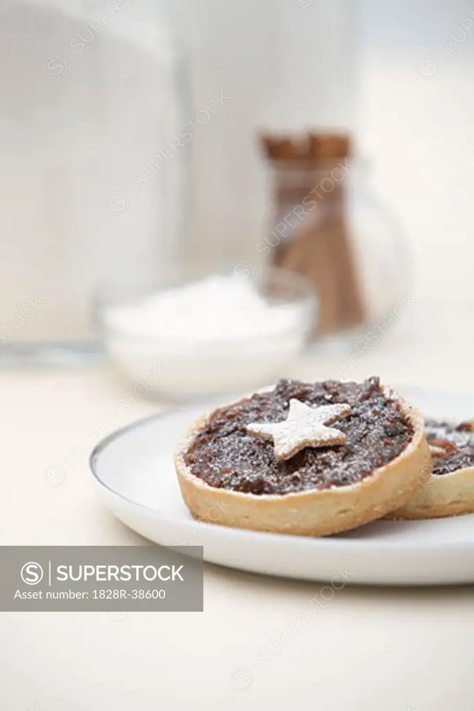 Mince Tarts on Plate with Baking Ingredients in Background   