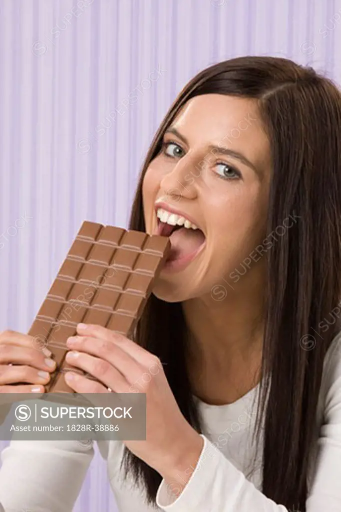 Woman Eating Chocolate Bar   