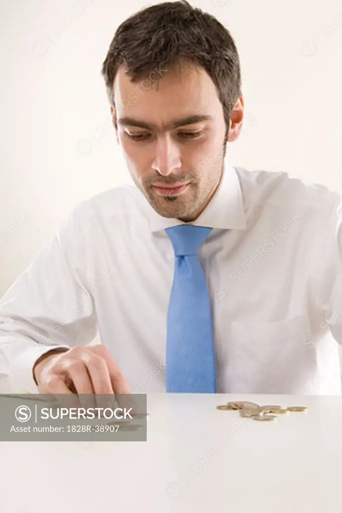 Man Counting Coins   