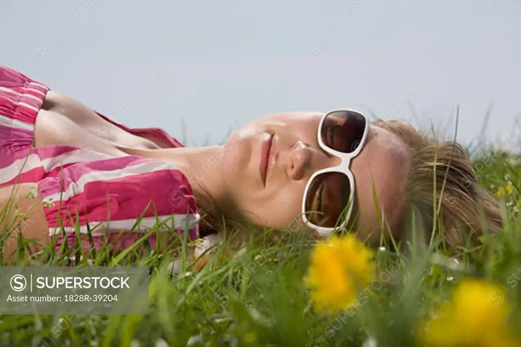 Woman Lying Down in Meadow   