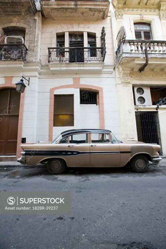 Car Parked by Building, Havana, Cuba   