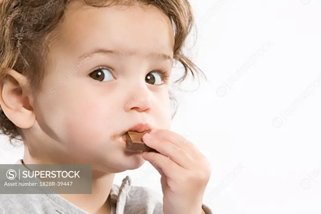 Little Girl Eating Chocolate   