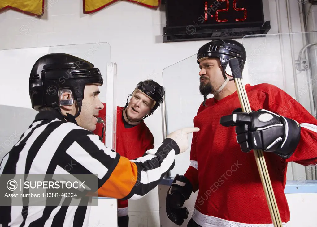 Referee Penalizing Hockey Players   