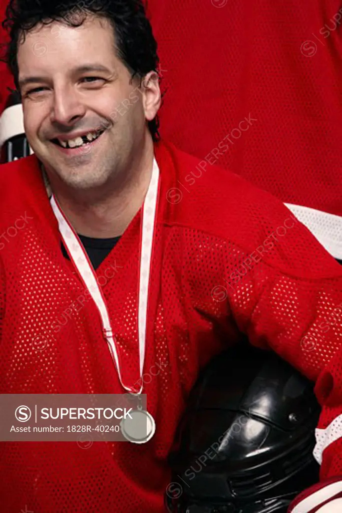 Portrait of Hockey Player Wearing Medal   