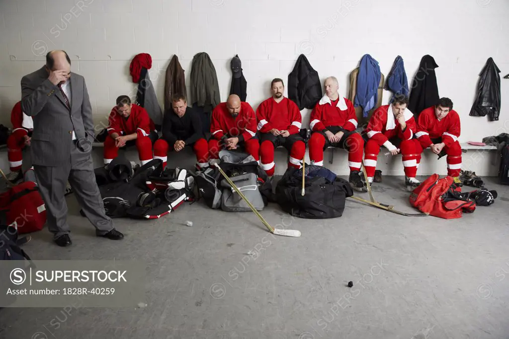Coach and Hockey Players in Dressing Room   