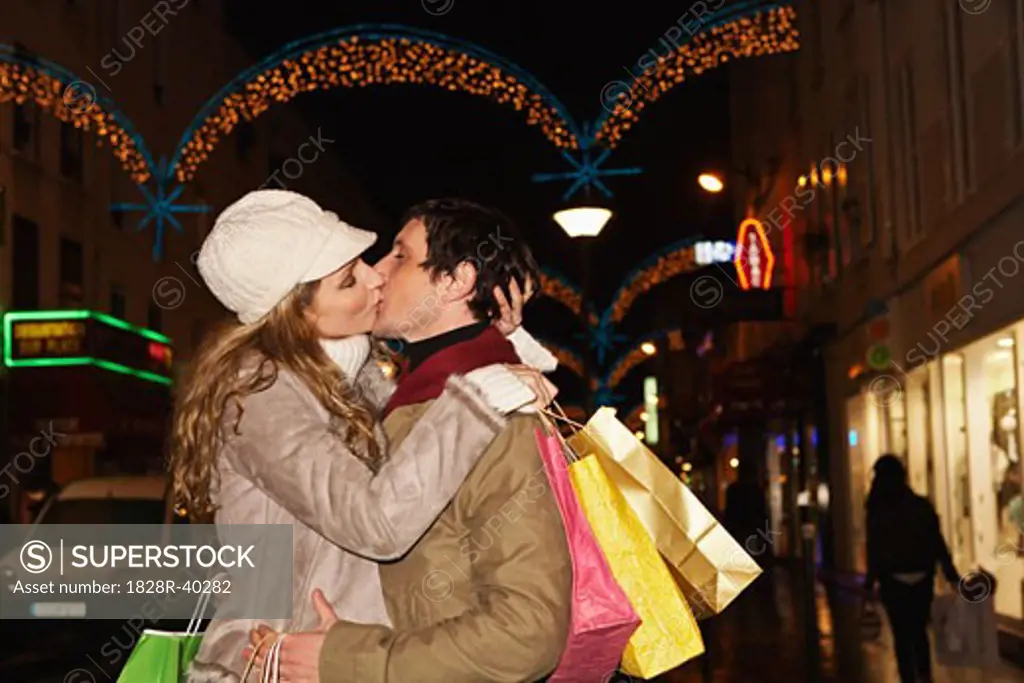 Couple Christmas Shopping, Kissing   