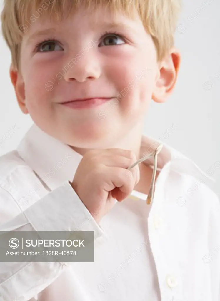 Portrait of Boy Holding Wishbone   