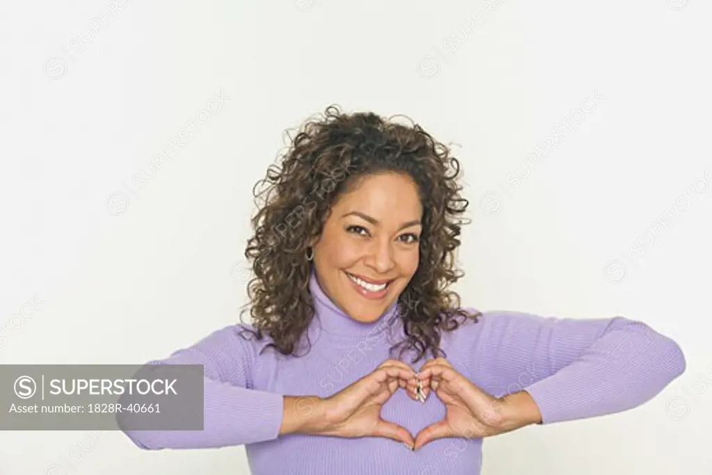 Portrait of Woman Making Heart Shape With Hands   