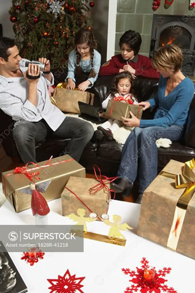 Family Opening Christmas Presents   