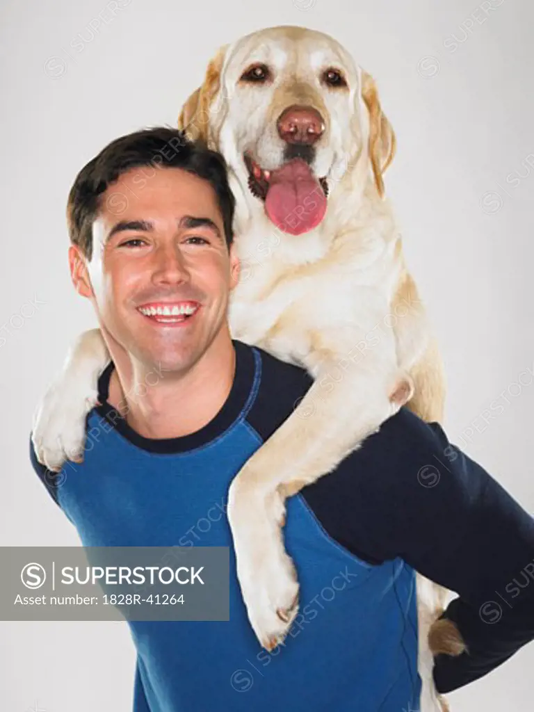 Portrait of Man with Labrador Retriever   