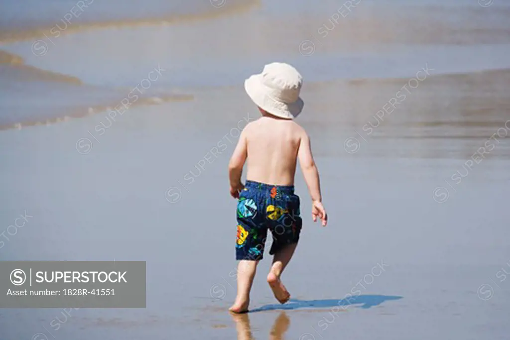 Boy Running on Beach, San Diego, California, USA   