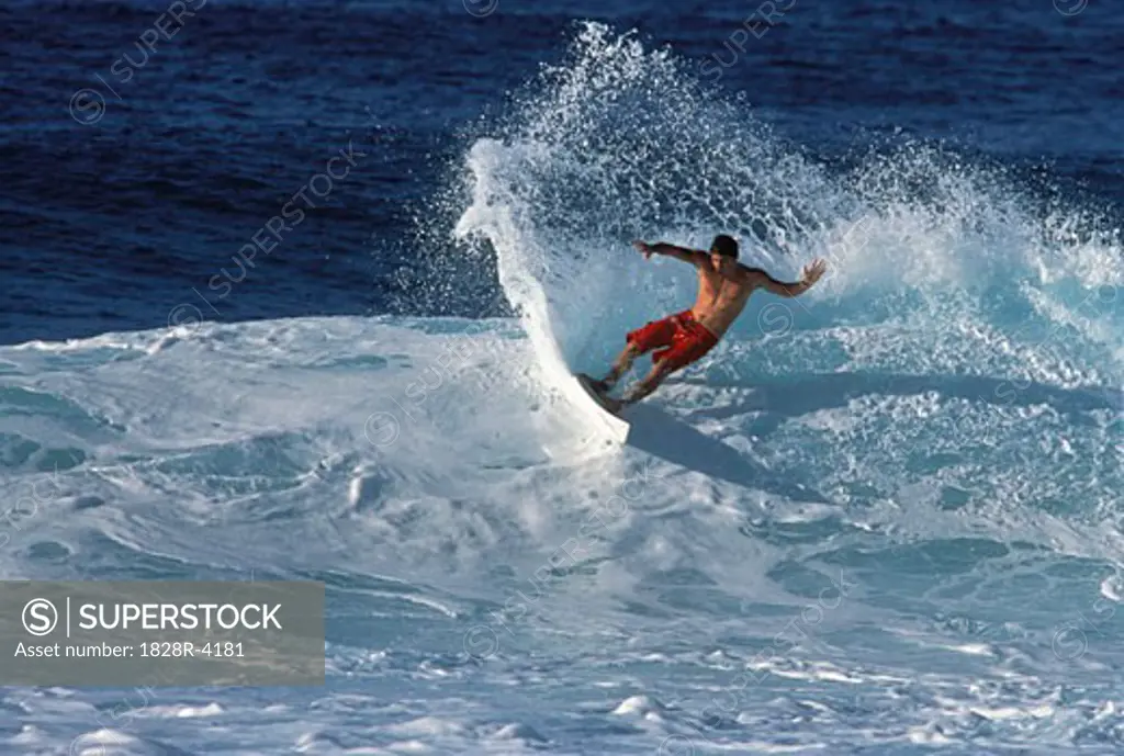Man Surfing Oahu, Hawaii, USA   
