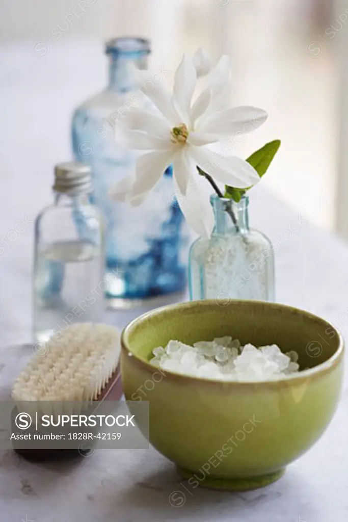 Bowl of Bath Salts with Scrub Brush, Flower and Oils   