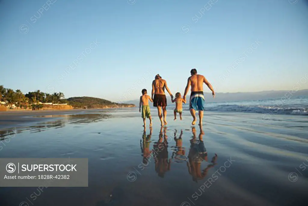 Family Walking on Beach, Mexico   