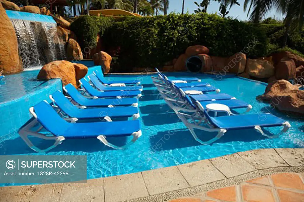 Lounge Chairs in Swimming Pool, Fairmont Rancho Banderas, Bahia de Banderas, Nayarit, Mexico   
