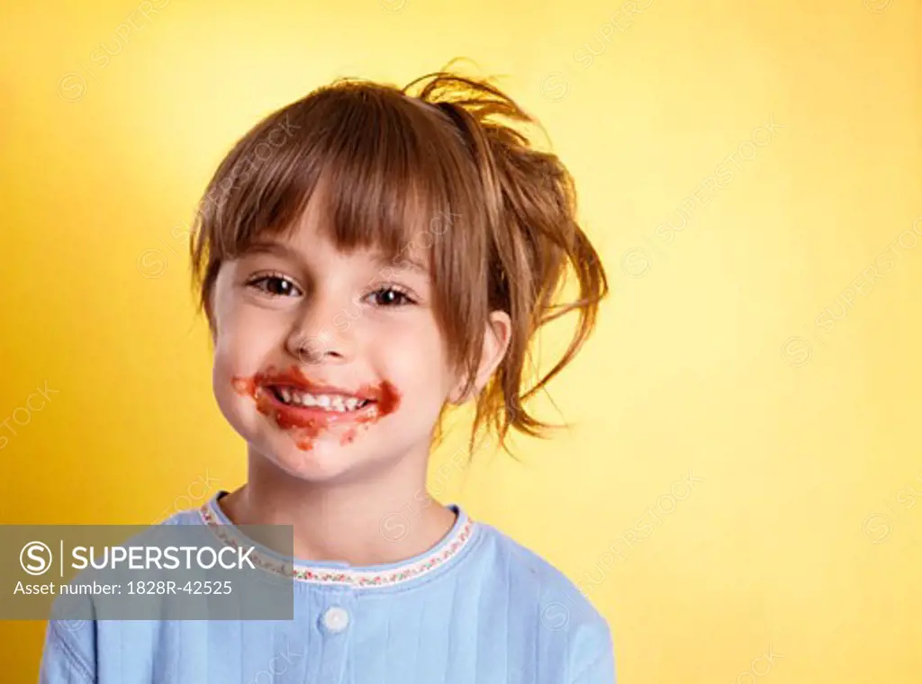 Portrait of Girl With Spaghetti Sauce on Face   