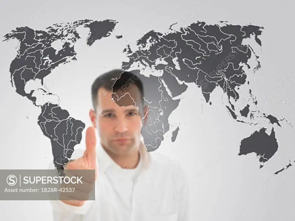 Portrait of Man Giving Thumbs Up in Front of World Map   