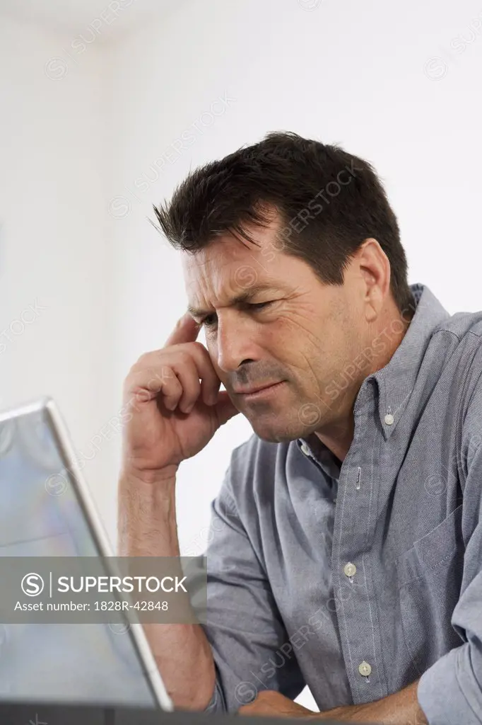 Man Looking at Computer Screen   
