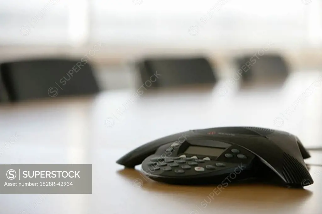 Conference Phone on Boardroom Table   