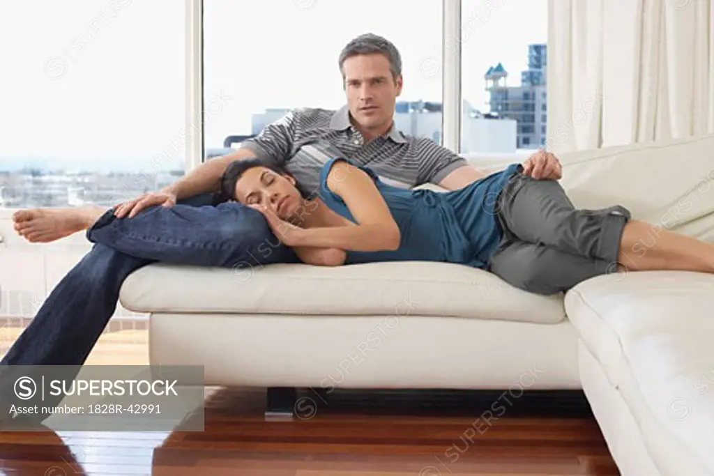 Couple on Sofa in Condominium   