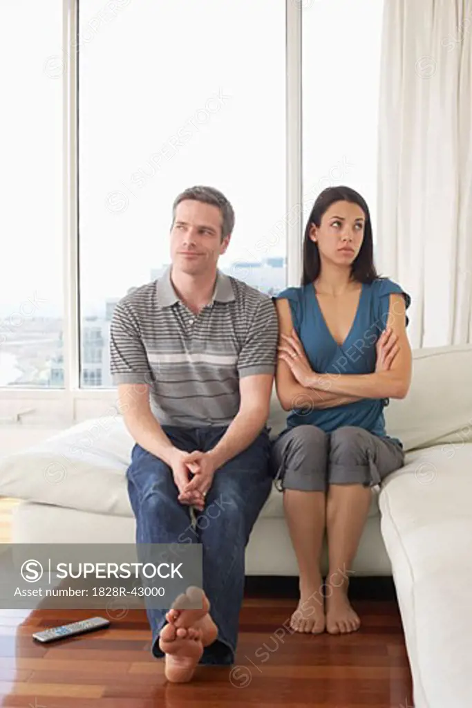 Couple on Sofa in Condominium   