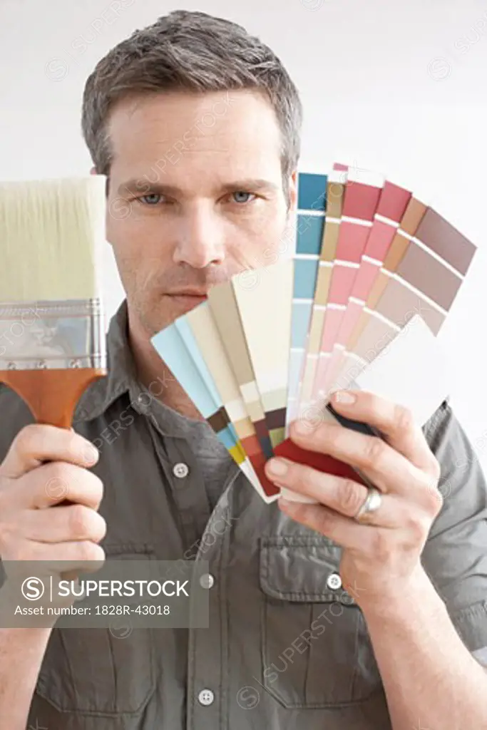 Man with Color Swatches and Paint Brush   