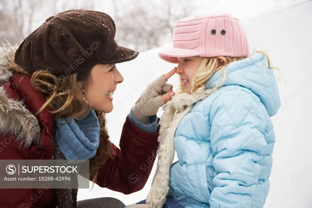 Mother and Daughter Outdoors in Winter   
