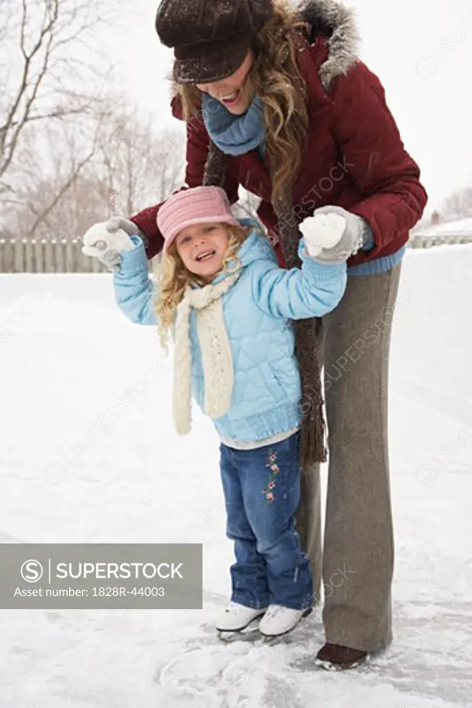 Mother Teaching Daughter to Skate   