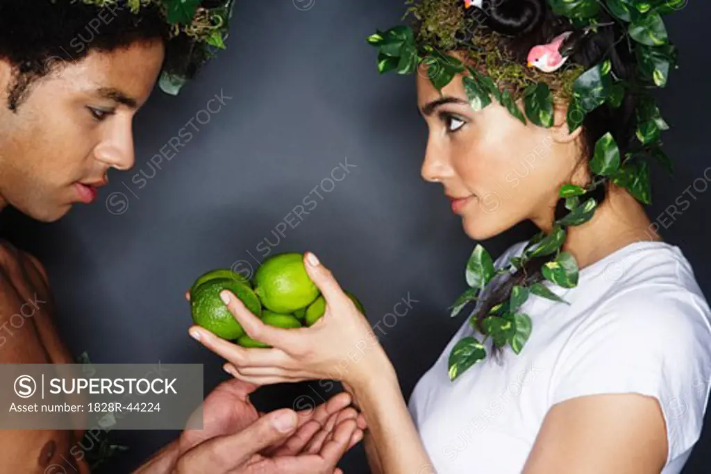 Couple With Wreaths in Hair, Holding Limes   